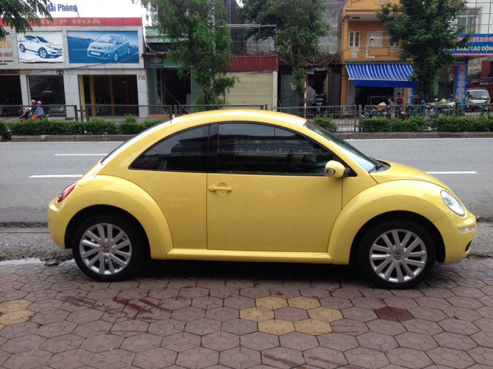 Volkswagen New Beetle 2.0AT 2009 - Cần bán xe Volkswagen New Beetle 2.0 đời 2009, màu vàng, nhập khẩu nguyên chiếc
