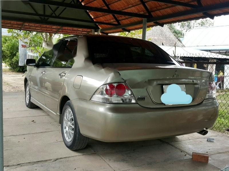 Mitsubishi Lancer GLX 1.6AT 2005 - Bán xe cũ Mitsubishi Lancer GLX 1.6AT đời 2005, màu vàng số tự động, 290 triệu
