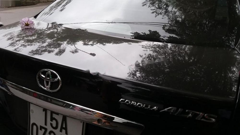 Toyota Corolla altis MT 2011 - Bán Toyota Corolla Altis MT sản xuất 2011, màu đen số sàn giá cạnh tranh