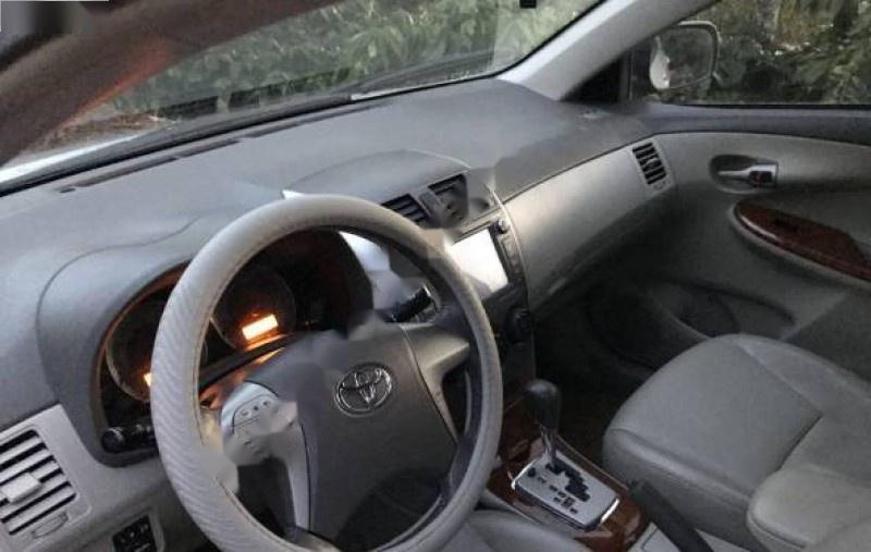 Toyota Corolla altis 1.8G AT 2009 - Bán Toyota Corolla altis 1.8G AT đời 2009, màu bạc, 570tr