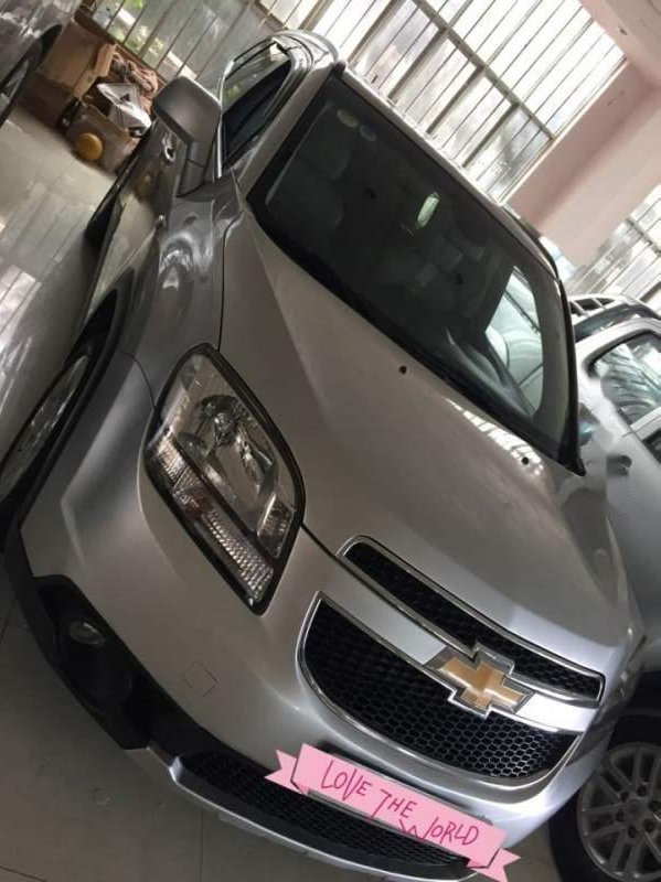 Chevrolet Orlando 2013 - Cần bán gấp Chevrolet Orlando sản xuất năm 2013, màu bạc như mới