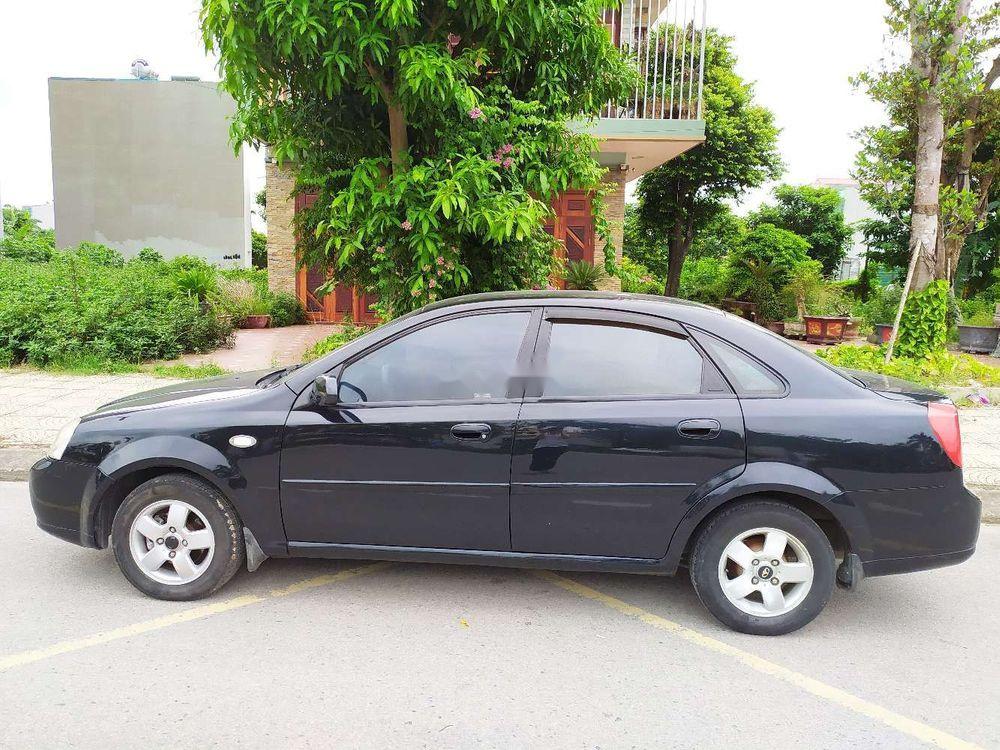 Daewoo Lacetti EX 2005 - Nhà bán Daewoo Lacetti EX đời 2005, màu đen số sàn