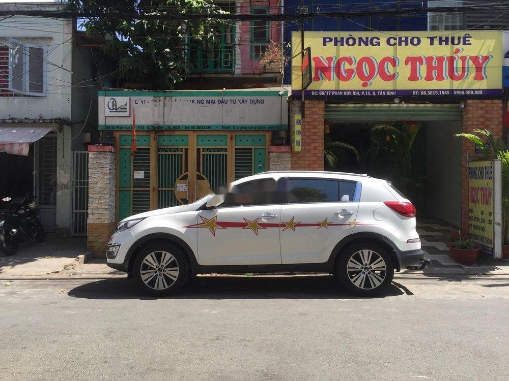 Kia Sportage      2.0AT  2014 - Cần bán gấp Kia Sportage 2.0AT năm sản xuất 2014, màu trắng giá cạnh tranh