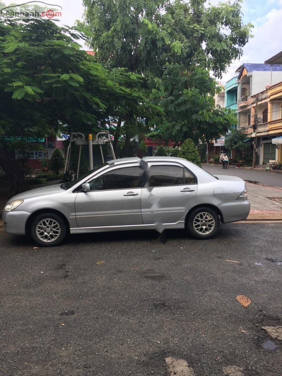 Mitsubishi Lancer  GLX 1.6AT 2003 - Cần bán Mitsubishi Lancer GLX 1.6AT đời 2003, màu bạc xe gia đình