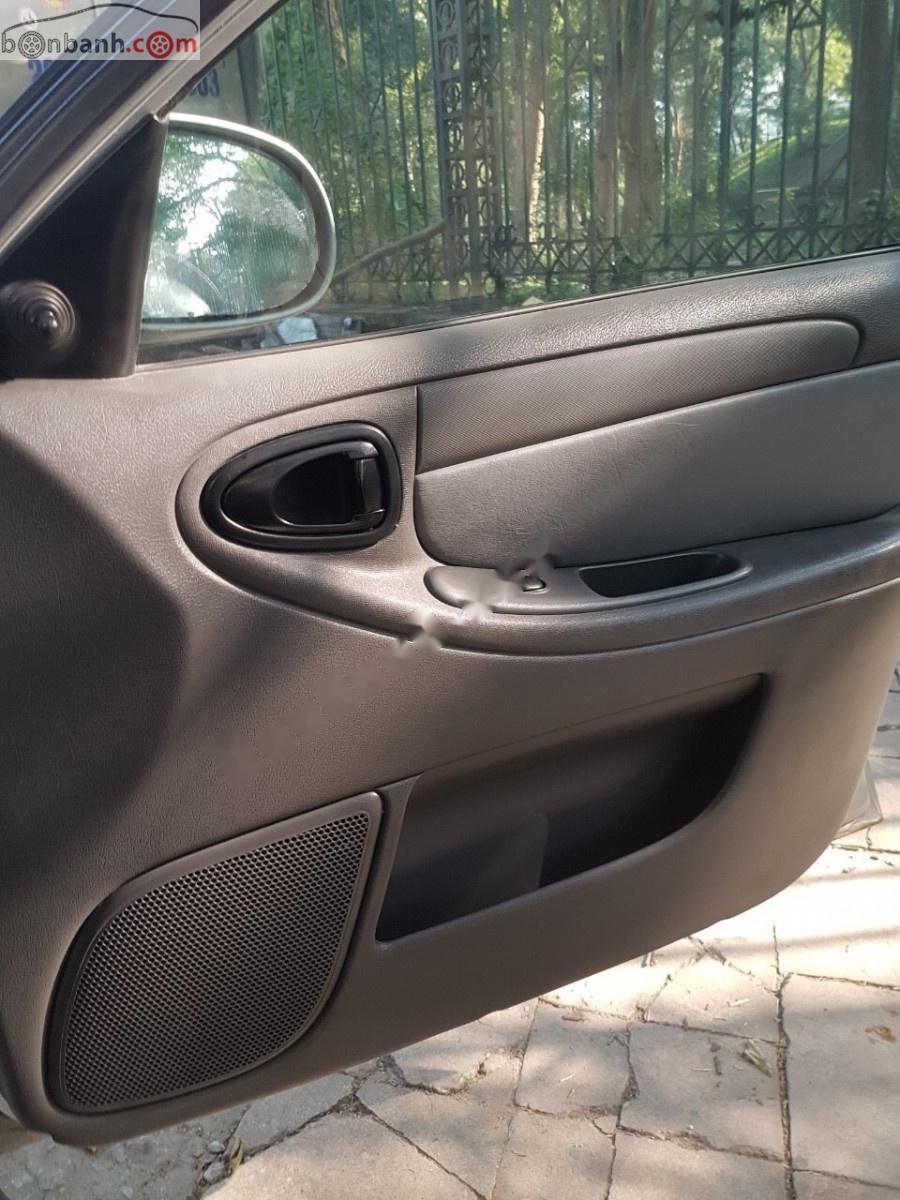 Daewoo Lanos SX 2004 - Cần bán xe Daewoo Lanos SX sản xuất 2004, màu bạc chính chủ giá cạnh tranh