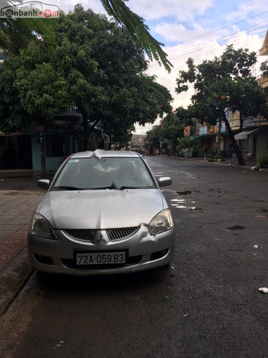 Mitsubishi Lancer  GLX 1.6AT 2003 - Cần bán Mitsubishi Lancer GLX 1.6AT đời 2003, màu bạc xe gia đình