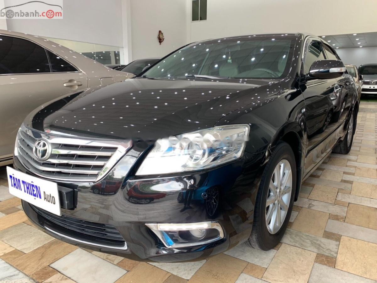 Toyota Camry 2.4G 2010 - Cần bán Toyota Camry 2.4G năm 2010, màu đen xe gia đình