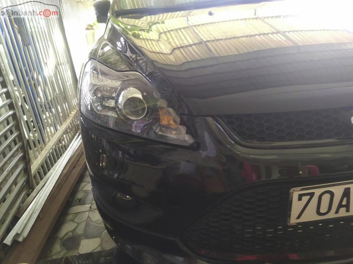 Ford Focus 1.8 AT 2011 - Bán Ford Focus 1.8 AT sản xuất 2011, màu đen số tự động, 320tr