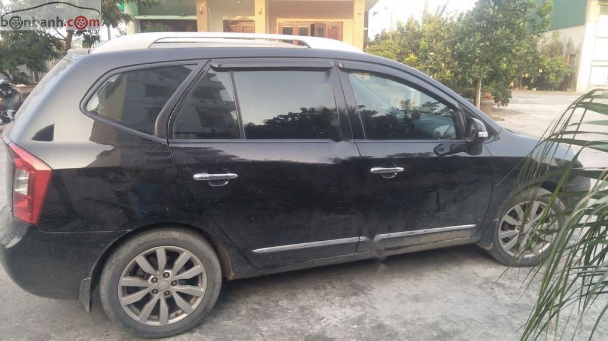 Kia Carens   2012 - Bán xe Kia Carens đời 2012, màu đen xe còn mới lắm