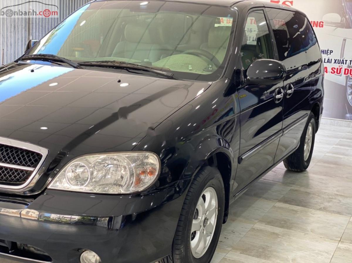 Kia Carnival 2008 - Bán ô tô Kia Carnival GS 2.5 AT sản xuất 2008, màu đen số tự động xe còn mới lắm
