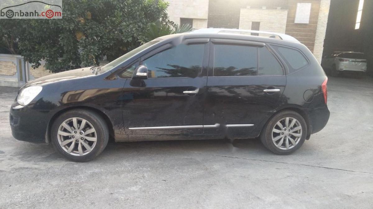 Kia Carens   2012 - Bán xe Kia Carens đời 2012, màu đen xe còn mới lắm