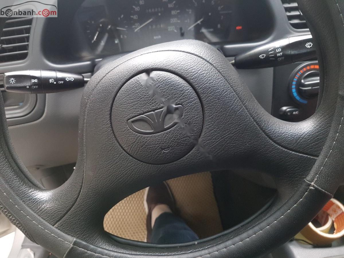 Daewoo Lanos SX 2004 - Cần bán xe Daewoo Lanos SX sản xuất 2004, màu bạc chính chủ giá cạnh tranh