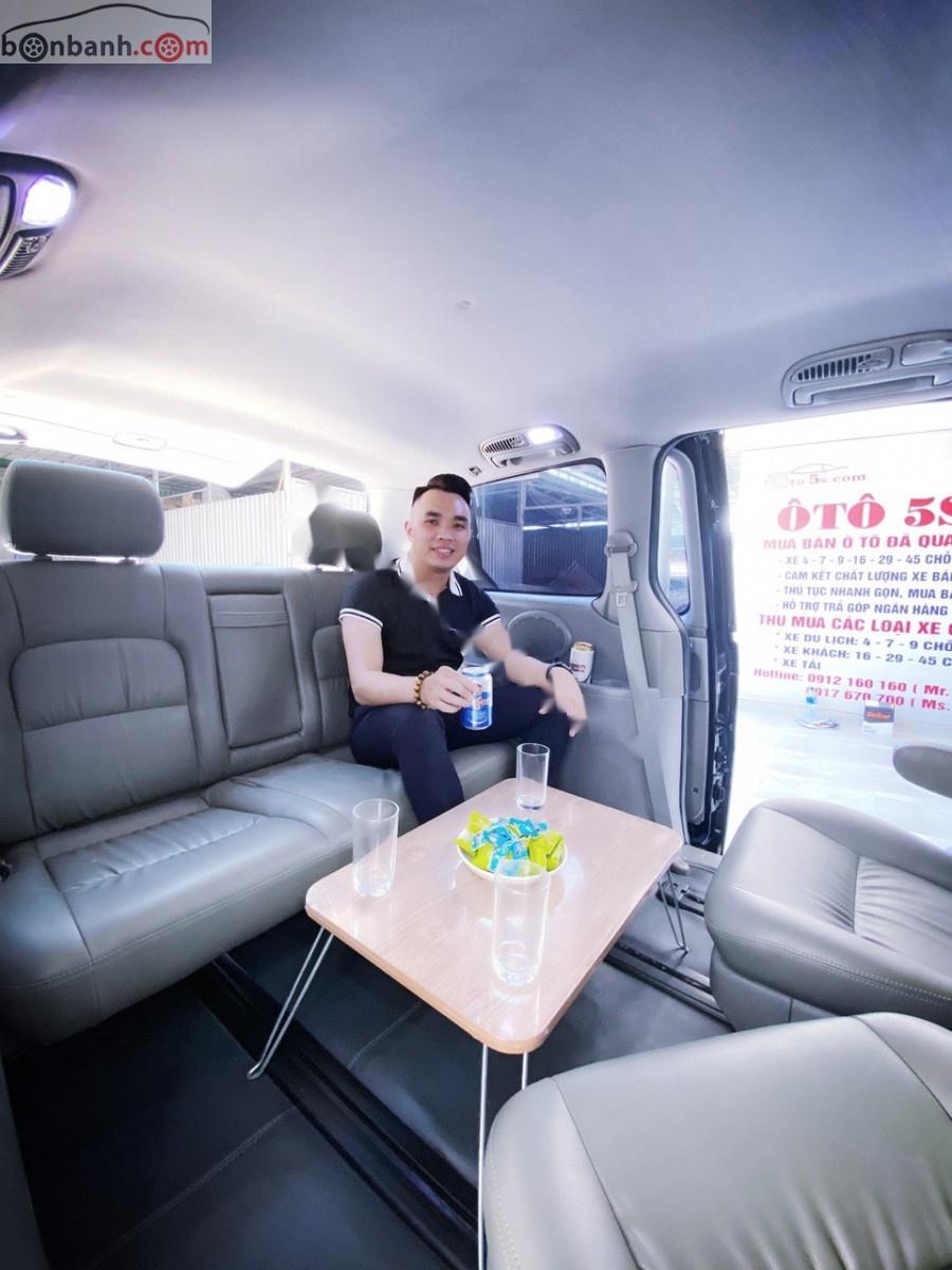 Kia Carnival 2008 - Bán ô tô Kia Carnival GS 2.5 AT sản xuất 2008, màu đen số tự động xe còn mới lắm