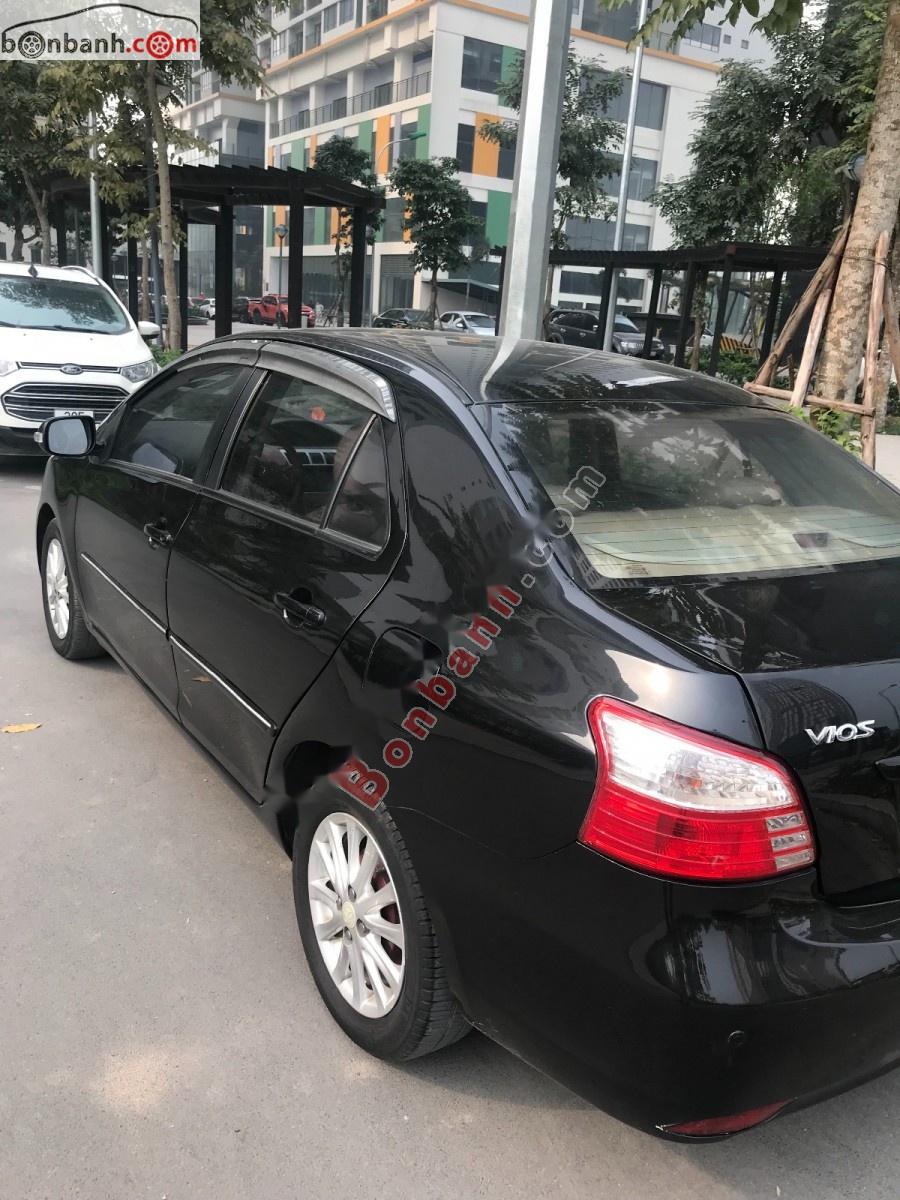Toyota Vios  E 2011 - Bán ô tô Toyota Vios E sản xuất năm 2011, màu đen xe gia đình, giá tốt