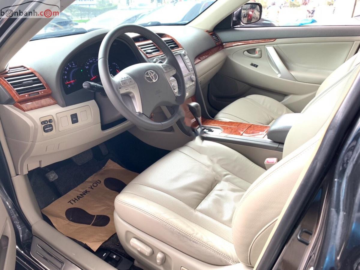 Toyota Camry 2.4G 2010 - Cần bán Toyota Camry 2.4G năm 2010, màu đen xe gia đình
