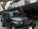 Jeep Wrangler Unlimited Sport 2010 - Cần bán gấp Jeep Wrangler Unlimited Sport 2010, màu đen, xe nhập chính chủ