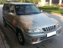 Ssangyong Musso 2001 - Cần bán gấp Ssangyong Musso đời 2001, màu vàng