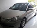 Mitsubishi Lancer GLX 2003 - Cần bán xe Mitsubishi Lancer GLX sản xuất 2003, màu vàng xe gia đình, giá chỉ 230 triệu