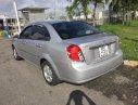 Daewoo Lacetti 2009 - Gia đình bán xe Daewoo Lacetti đời 2009, màu bạc