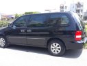 Kia Carnival 2007 - Cần bán Kia Carnival đăng ký 2007, màu đen còn mới, giá tốt 235tr