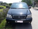 Kia Carnival 2007 - Cần bán Kia Carnival đăng ký 2007, màu đen còn mới, giá tốt 235tr