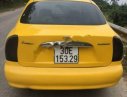 Daewoo Lanos SX 2002 - Cần bán lại xe Daewoo Lanos SX 2002, màu vàng, giá 79tr