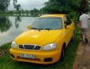 Daewoo Lanos SX 2002 - Cần bán lại xe Daewoo Lanos SX 2002, màu vàng, giá 79tr