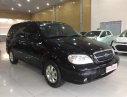 Kia Carnival 2005 - Cần bán lại xe Kia Carnival đời 2005, màu đen, giá chỉ 225 triệu