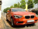 BMW 1 Series  116i  2014 - Chính chủ bán BMW 1 Series 116i đời 2014, màu cam