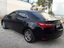 Toyota Corolla altis 2014 - Bán Toyota Corolla altis đời 2014, màu đen xe gia đình  