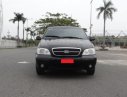 Kia Carnival GS 2.5 AT 2008 - Bán xe Kia Carnival GS 2.5 AT đời 2008, màu đen xe gia đình