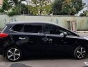 Kia Rondo GAT  2015 - Cần bán lại xe Kia Rondo GAT đời 2015, màu đen ít sử dụng, 590 triệu