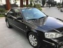 Ford Laser   Deluxe MT  2006 - Cần bán lại xe Ford Laser Deluxe MT năm 2006, màu đen như mới, giá 248tr