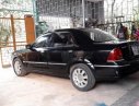 Ford Laser GHIA 1.8 AT 2005 - Bán xe Ford Laser GHIA 1.8 AT đời 2005, màu đen 