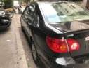 Toyota Corona  G 1.8  2004 - Cần bán gấp Toyota Corona G 1.8 sản xuất 2004, màu đen số sàn