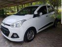 Hyundai i10 1.0AT  2014 - Cần bán Hyundai i10 1.0AT sản xuất 2014, màu trắng xe gia đình
