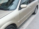 Ford Laser GHIA 1.8 MT 2002 - Chính chủ bán xe Ford Laser GHIA 1.8 MT đời 2002, màu vàng