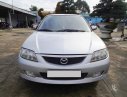 Mazda 323 2003 - Cần Bán Mazda 323 sản xuất 2003, màu bạc, xe gia đình đi