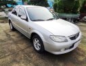 Mazda 323 2003 - Cần Bán Mazda 323 sản xuất 2003, màu bạc, xe gia đình đi