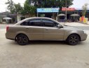 Daewoo Lacetti CDX 2005 - Cần bán Daewoo Lacetti CDX năm 2005, màu vàng, giá 128tr