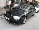 Kia Spectra 2003 - Bán ô tô Kia Spectra năm 2003, cam kết không taxi không dịch vụ màu đen, giá chỉ 100 triệu