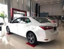 Toyota Corolla altis 1.8 E MT 2018 - Cần bán Toyota Corolla Altis 1.8 E MT sản xuất 2018, màu trắng, xe mới 100%