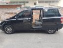 Kia Carnival 2.7 MT 2010 - Bán Kia Carnival 2.7 MT năm 2010, màu đen, nhập khẩu nguyên chiếc  