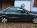 Ford Laser   1.8 MT  2002 - Cần bán xe Ford Laser 1.8 MT đời 2002, màu đen 