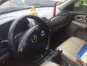 Mazda 323 2003 - Bán Mazda 323 sản xuất năm 2003, màu đen xe gia đình giá cạnh tranh