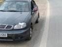 Daewoo Lanos SX 2001 - Bán Daewoo Lanos màu đen, đời 2001, xe đang chạy bình thường, gia đình đang sử dụng