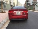 Kia Cerato    AT 2010 - Nhà tôi muốn bán chiếc xe Kia Cerato số tự động, màu đỏ, bản đầy đủ nhất