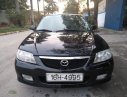 Mazda 323 2003 - Cần bán xe Mazda 323 năm sản xuất 2003, màu đen, 150tr