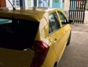 Kia Morning 2014 - Cần bán xe Kia Morning sản xuất 2014, màu vàng chính chủ