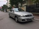 Daewoo Lanos SX 2004 - Cần bán gấp Daewoo Lanos SX 2004, màu bạc